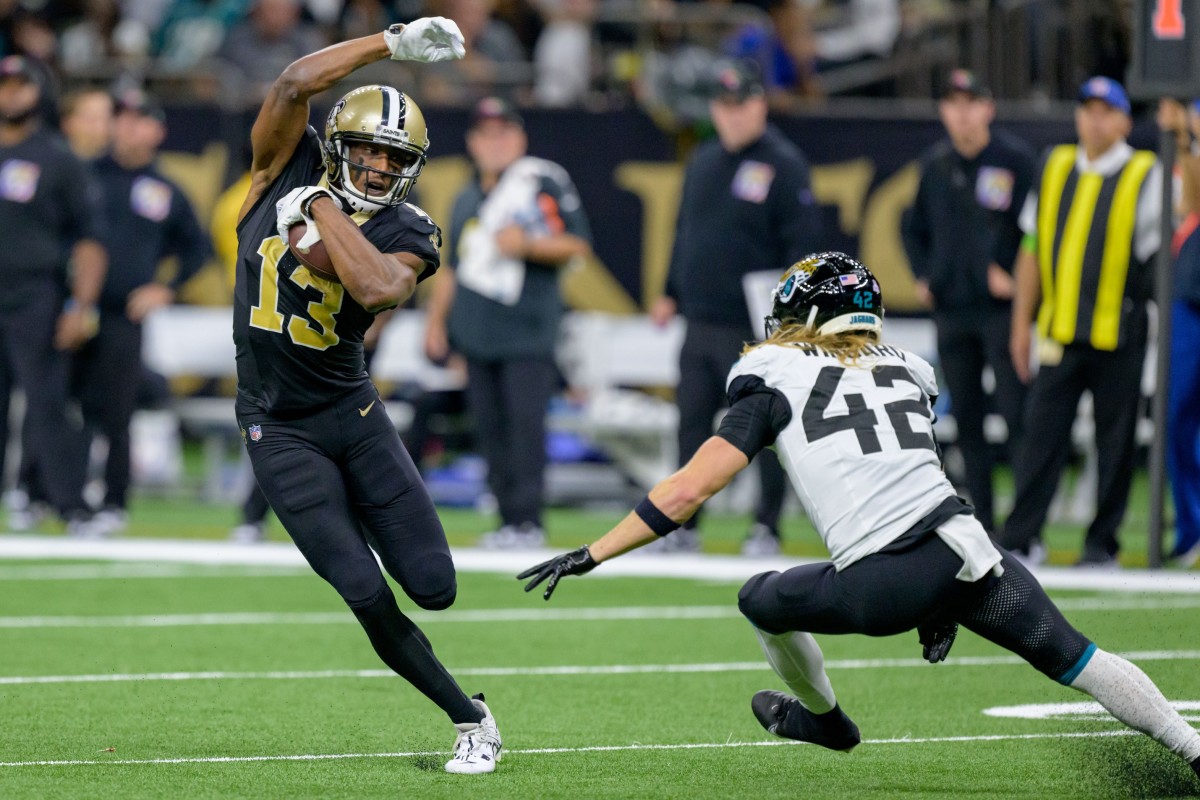 New Orleans Saints receiver Michael Thomas (13) runs after a reception against Jacksonville Jaguars safety Andrew Wingard (42). Mandatory Credit: Matthew Hinton-USA TODAY Sports